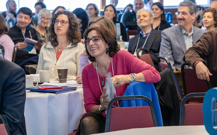 Persis Karim listening to keynote address. (photo_ Behnaz Khaleghi)