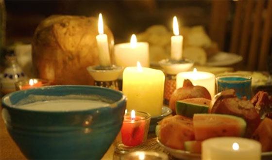 Candle lit table with food