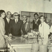 Old photo of engineers around a table